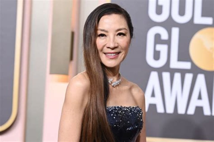 
Michelle Yeoh Takes Home Her First Golden Globe in a Crystal-Covered Armani Privé Gown 