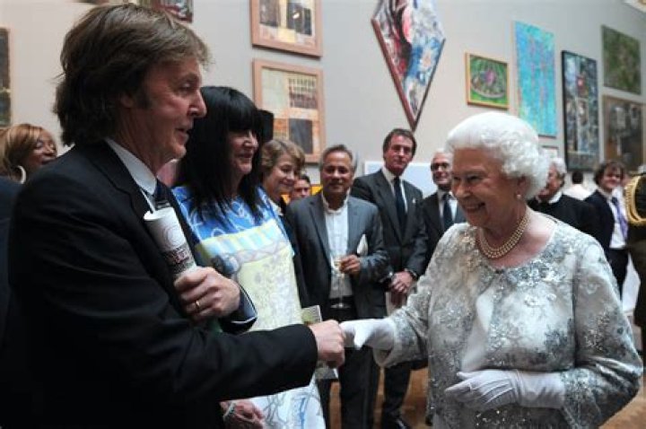 
Paul McCartney Whispered to Queen Elizabeth II and Made Her Laugh the Last Time They Met 